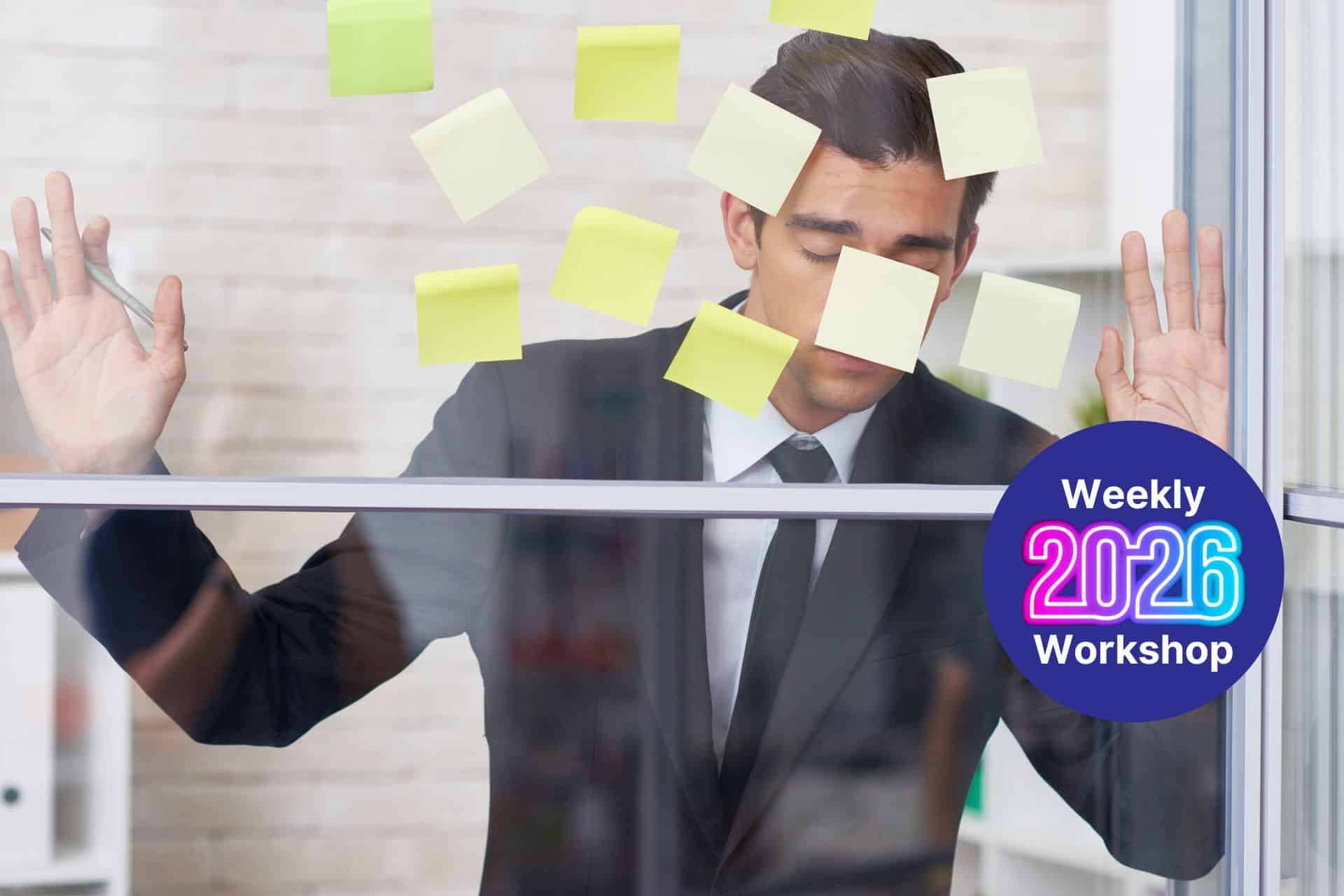 Man in a suit with sticky notes on a glass window, promoting a 2026 weekly workshop badge nearby