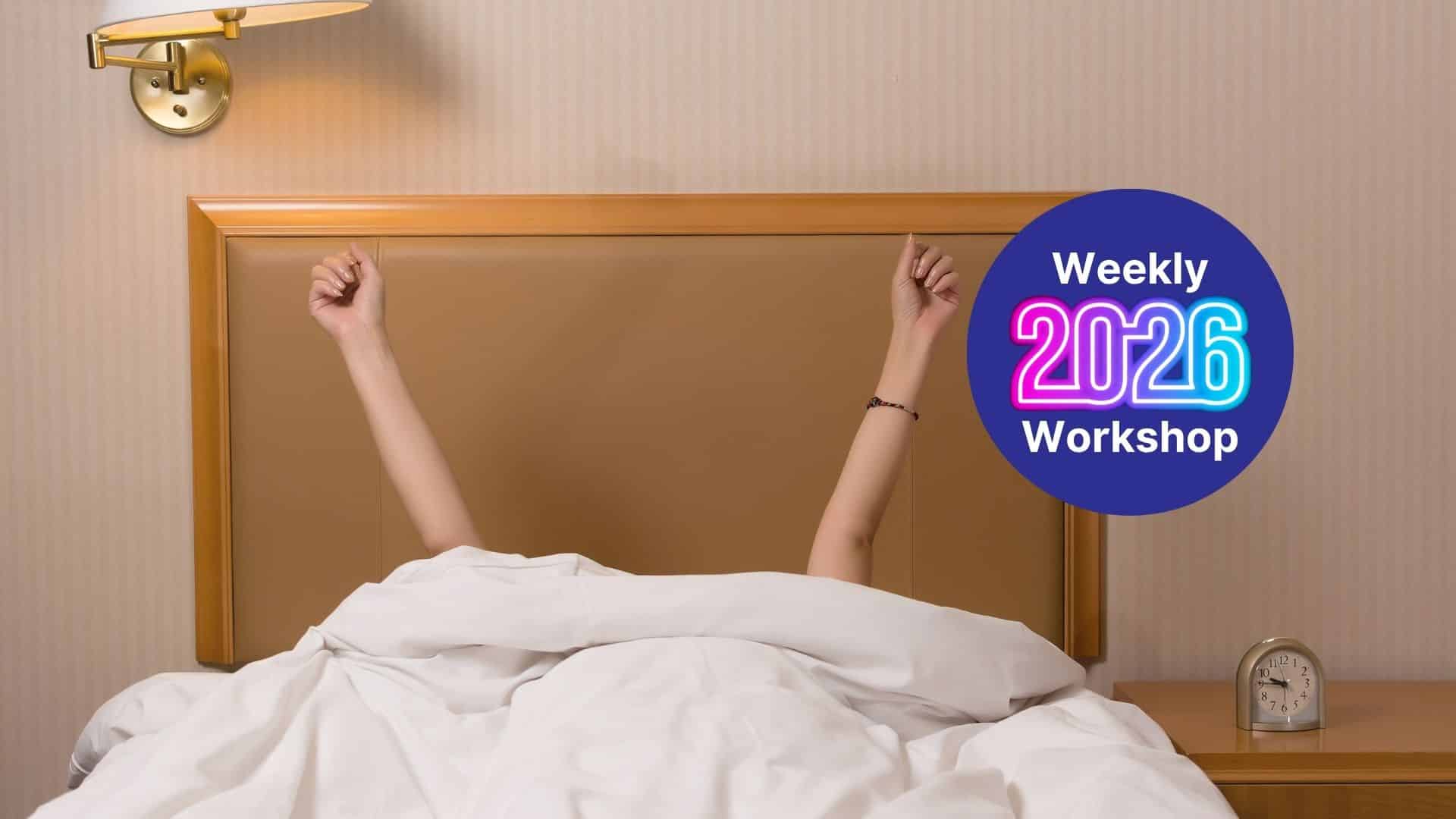 Person sits up in bed with arms raised, a neon-styled 'Weekly 2026 Workshop' badge on the right, bedside clock and wall lamp visible.
