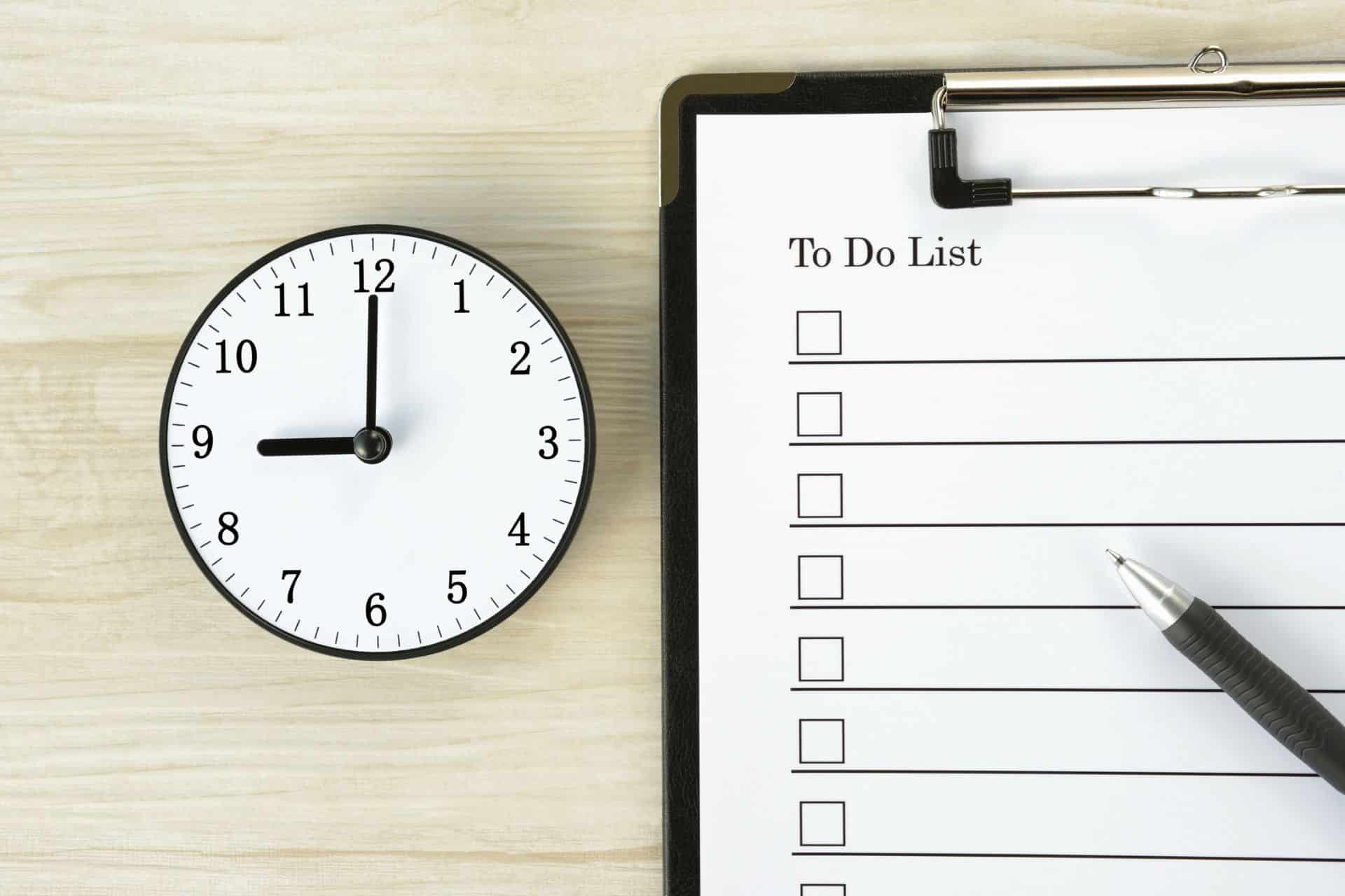 do this before 9am - The Sales Vault - The Sales Vault Clock beside a clipboard with a To Do List and a pen on a light wood surface, conveying time and planning cues.